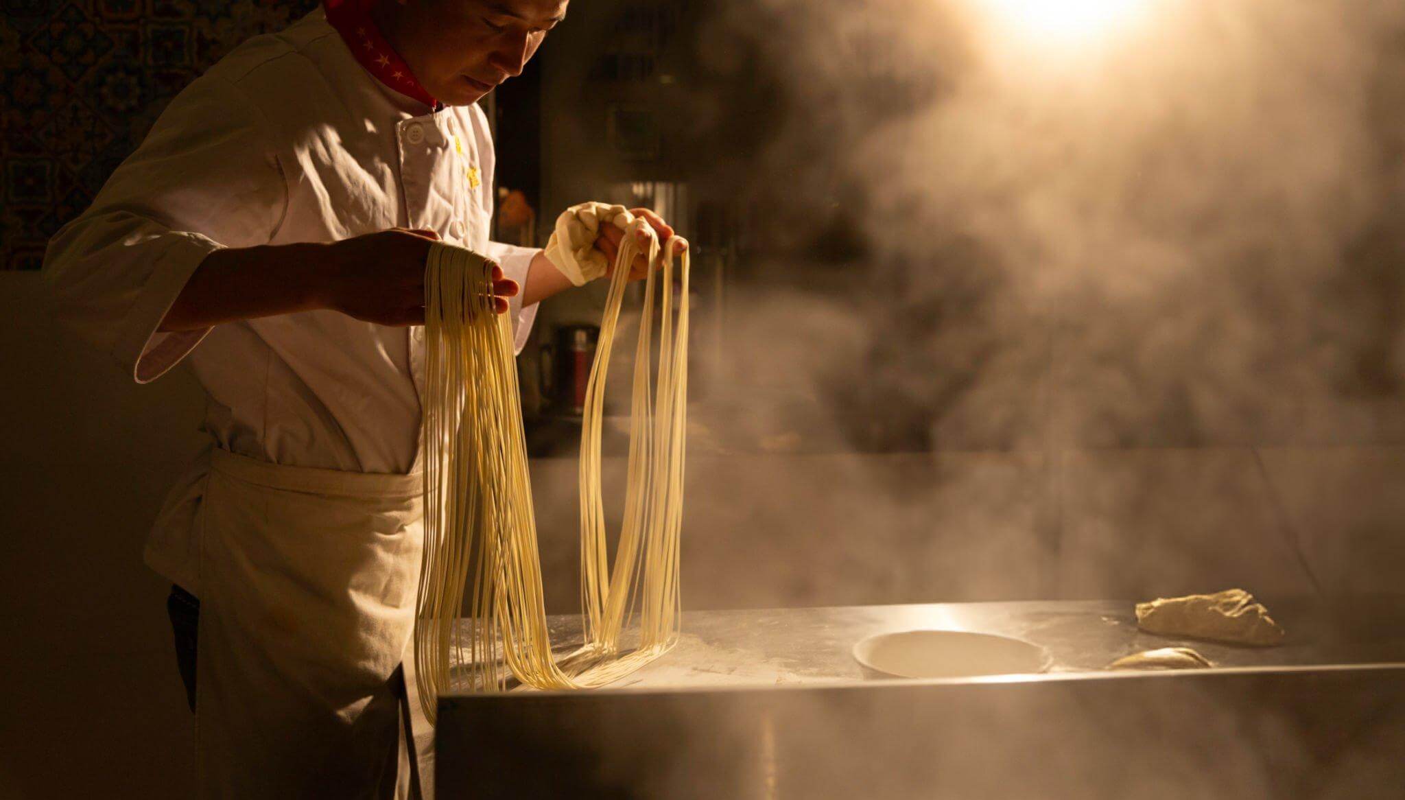 The noodle chef is making egg noodles